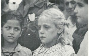 BLOND PALESTINIAN (above) is 10-year-old Lara al-Ghoush. The photograph was taken at the 1981 funeral of her parents, who had just been murdered by Lebanese Christians working for the Israelis. The Palestinians, like the Jews, are a racially mixed people, but there are still a number of unmixed Whites among them. After the initial Philistine settlement, there were several further infusions of European blood: from the Romans, who established a colony in Jerusalem in the first century, after expelling the Jews; from the German Crusaders, who founded several kingdoms in Palestine during the Middle Ages; and from later European settlers, who continued to colonize the area as late as the last century, primarily for Christian reasons.