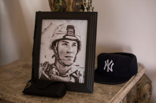 A portrait of Lance Cpl. Gregory Buckley Jr. in his family's home in Oceanside, N.Y. He was shot to death in 2012 by a teenage "tea boy" living on his base in Helmand Province.